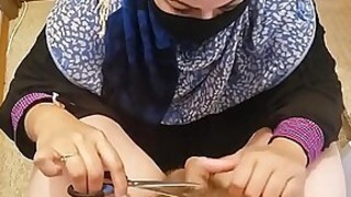 Arabian mom gives pedicure combined in ambient trim surrounding clamping