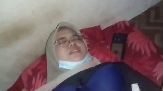 A pretty girl wearing a hijab gives oral and engages in intercourse