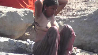 Indian girl with voluptuous figure takes outdoor bath in river in high definition