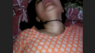 A teen with unshaved genitalia gives and receives intense pleasure, culminating in an orgasm on her abdomen while experiencing discomfort