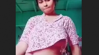 A stunning woman with large breasts engages in a passionate rendezvous