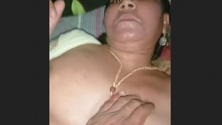 Elderly wife and her partner indulge in intimate activities in a rural setting