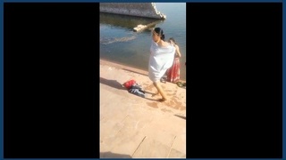 Indian village women bathe outdoors