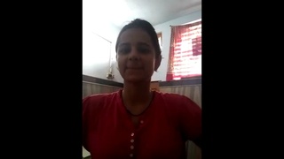 An enticing video featuring a busty Desi woman showcasing her assets