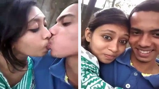Attractive Indian beauty engages in passionate kissing outdoors
