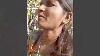 Randi engages in outdoor sex with a client in the doggie position