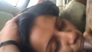A girlfriend pleasures her lover's cock in a car with passion