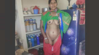 Rashma, the attractive older woman, undresses