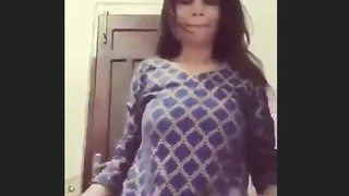 A young adult wearing a striped outfit misbehaves in the restroom