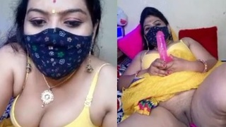 Geeta, the seductive aunt, moistly stimulates her intimate area with her fingers