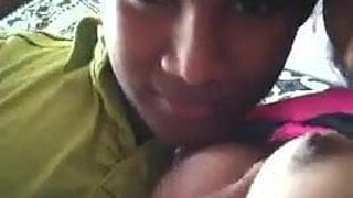A young woman from Sri Lanka with firm breasts kisses while fondling her nipples