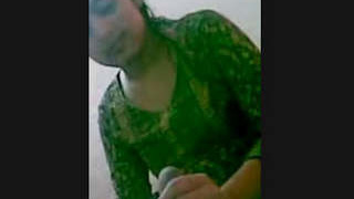 A seductive woman provides a pleasurable hand job and performs self-pleasure