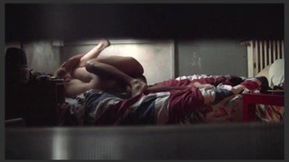 An older Indian woman engages in provocative behavior at her residence