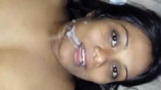 A girl engages in oral sex, intercourse, and receives a facial cumshot