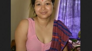 A South Asian wife with large breasts stimulates her husband and he ejaculates on her face
