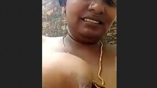 South Indian wife displays her large breasts and intimate area