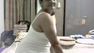 Indian mature woman engages in sexual activity with her husband's friend in a recorded video