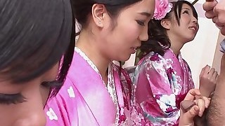 Three geishas sucking on one lonely cock