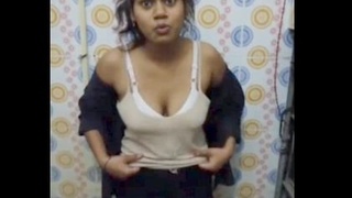 Indian woman undressing in restroom