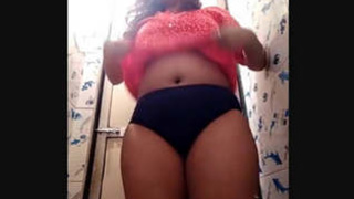 Chubby Indian woman indulges in risqué behavior in the restroom