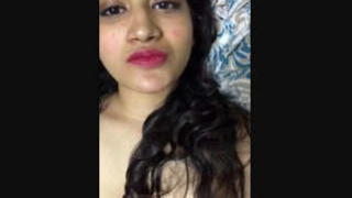 A charming South Asian girlfriend indulges in playful acts for her remote partner