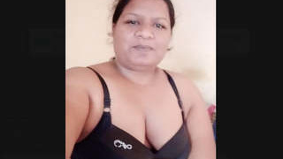Indian housewife displays her large breasts