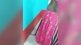 Hot as hell Desi woman in a sexy dress poses for the camera