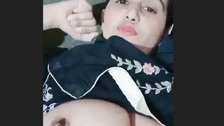 Pakistani wife with large breasts seductively unveils her allure
