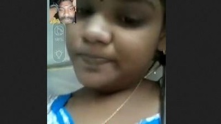 A charming girl displays her breasts