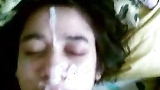 A scene from Pron where a young slut gets fucked and gets the biggest fountain of cum on her face