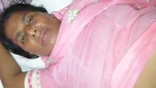 An Indian aunt masturbates while with a customer
