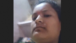 A Desi girl with large breasts is restrained by her lovers