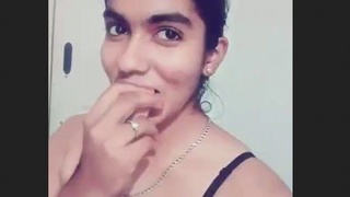 A seductive African-American woman exhibiting her charms, labeled as a bhabi.