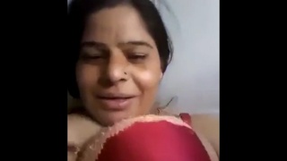 Middle-aged Indian woman pleasures herself and experiences squirting in rural setting