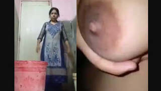 Indian aunty in the restroom washing and unveiling her ample bosom