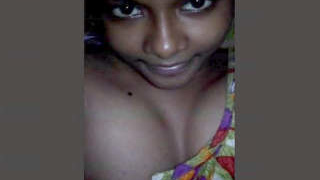 A charming Indian woman reveals her breasts