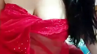 In a red mesh sari showing off her boobs and hips on StripChat Live