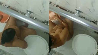 Indian spouse undresses for a bath captured on hidden camera