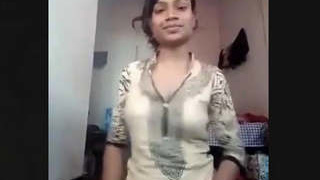 Aroused girl reveals her breasts