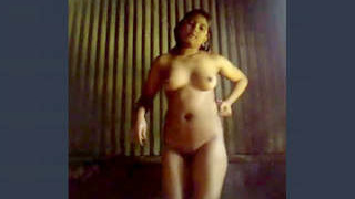 A stunning village belle from India sensually undressing and performing a dance routine post-bath