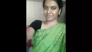 A busty Indian wife showcases her allure in a provocative saree