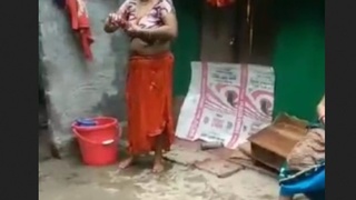 Married woman changes saree while bathing