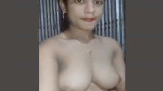 A Bengali woman reveals her breasts and intimate area