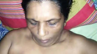 Elder woman performs a hand job and receives semen on her breasts