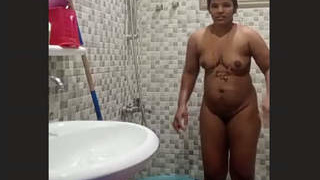 Elderly Indian wife takes nude selfies in the bathroom