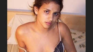 Indian girl undresses and seduces for financial gain in a heated striptease performance