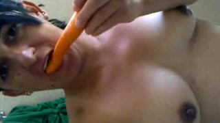 Arousing young amateur teen girl employs a carrot for her own gratification