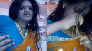 Indian housewife in traditional saree at home